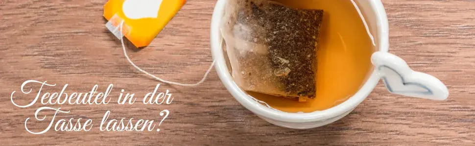 Tasse Holztisch Tee Teebeutel